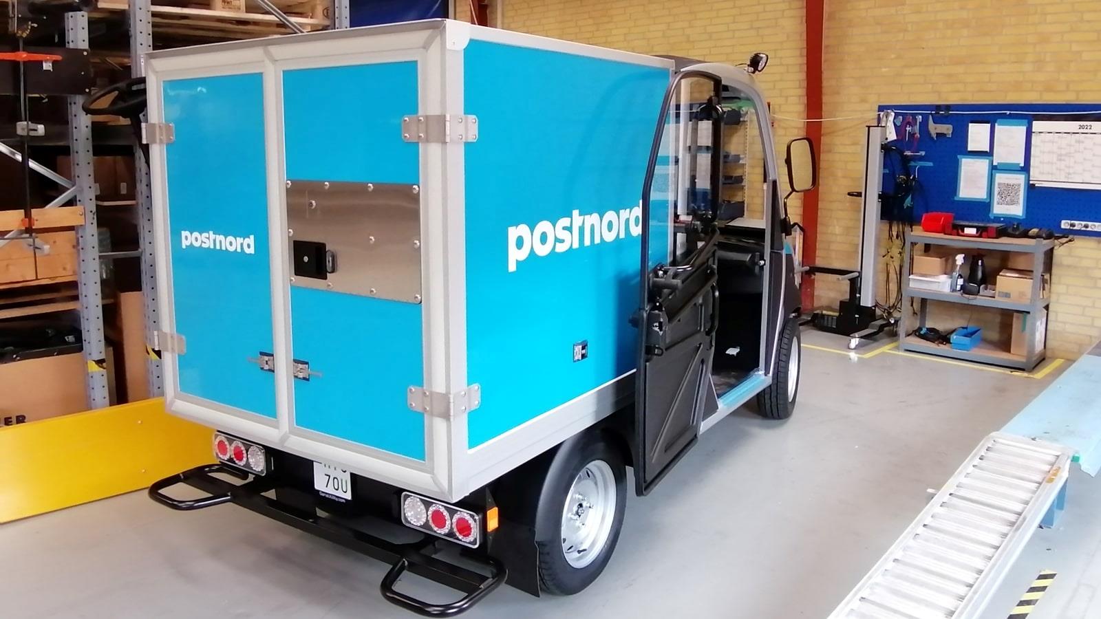  Small blue electric car produced by Garia for Postnord